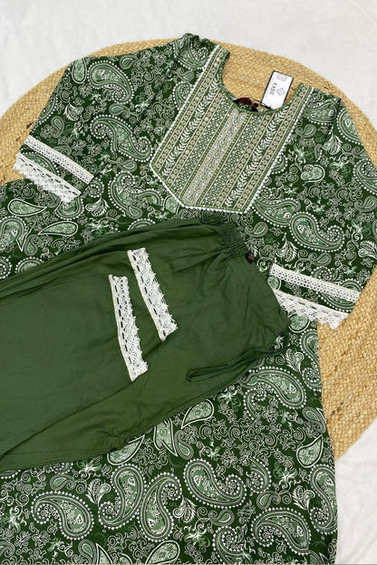 Green and white patterned garment on a textured surface
